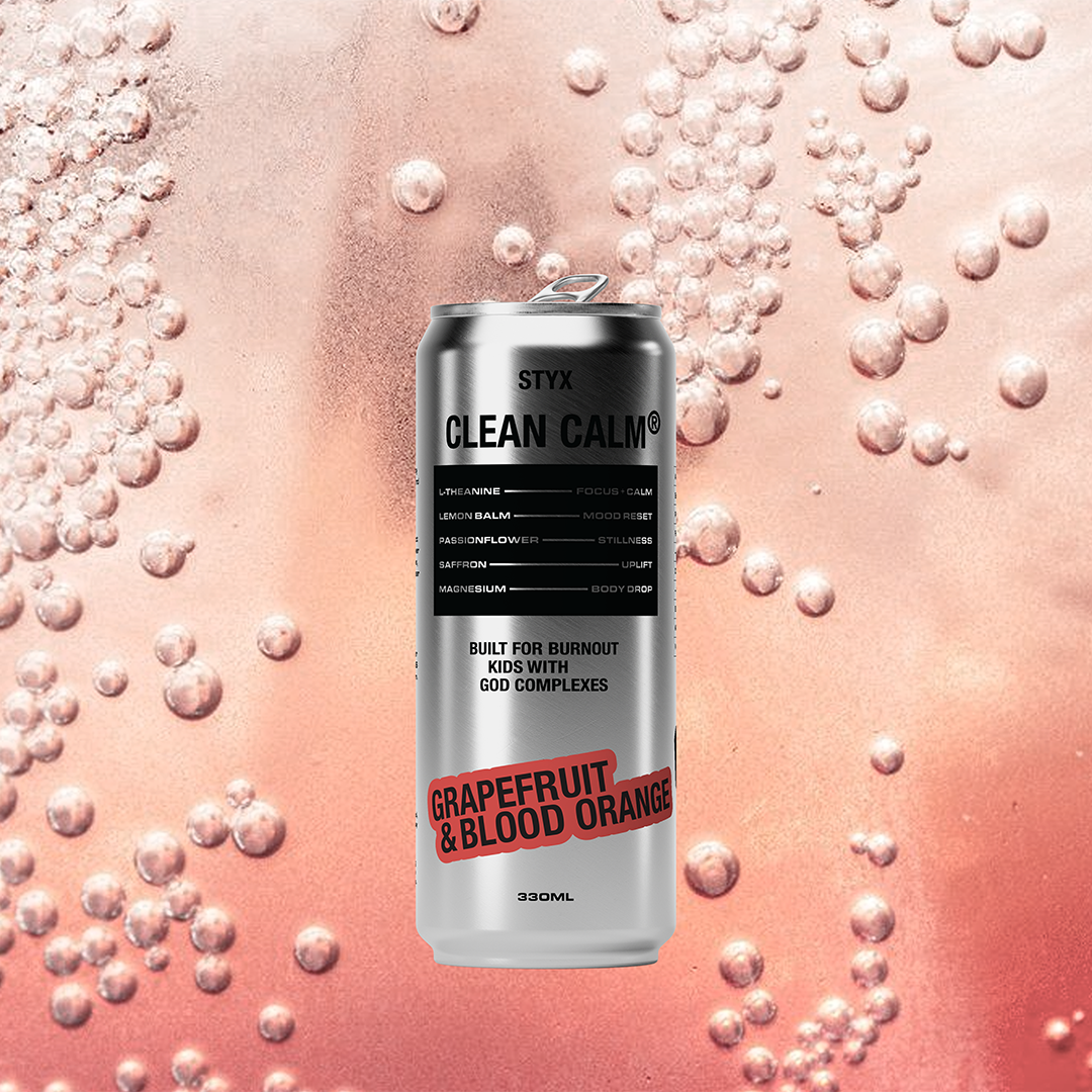 Can of Grapefruit & Blood Orange soda with bubbles on a pink background